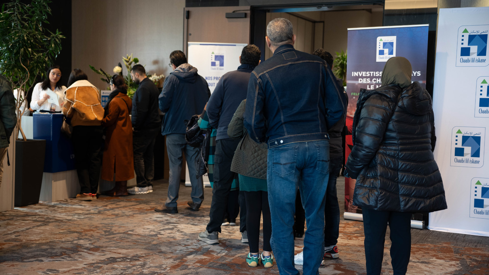 Visitors at the Chaabi Lil Iskane welcome area during the 2025 salon